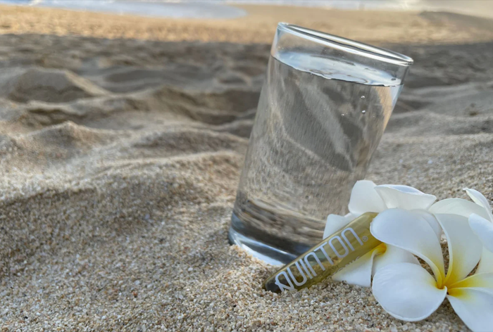 Image of the ocean beach Quinton glass of water