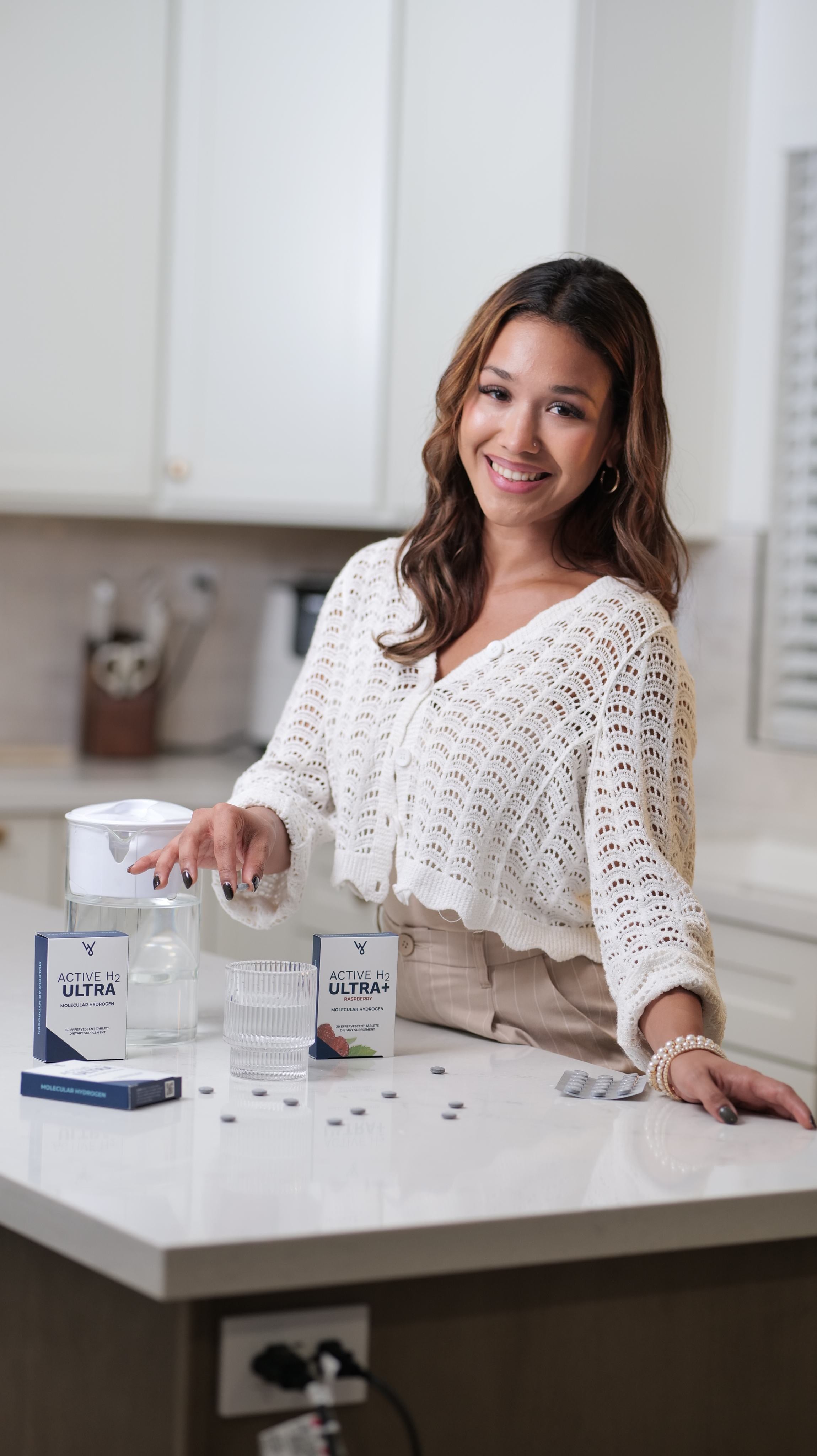 Woman preparing the Terrain Protocol with Water and Wellness products